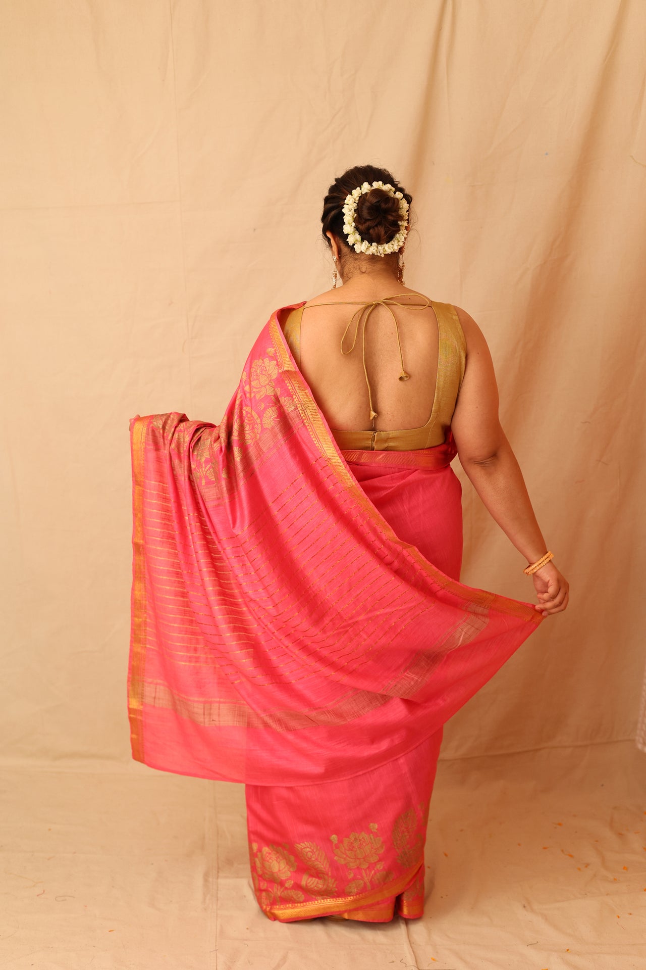 Mesmerizing Pink Semi-Silk Saree with Gold Lotus & Peacock Border Print