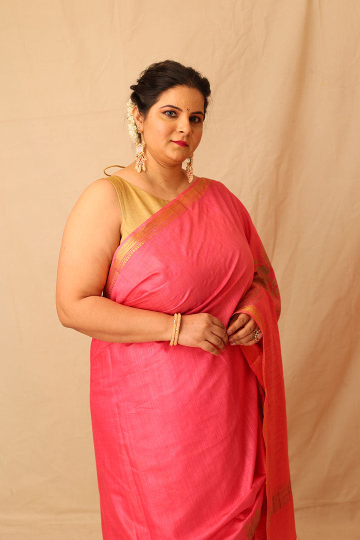 Mesmerizing Pink Semi-Silk Saree with Gold Lotus & Peacock Border Print