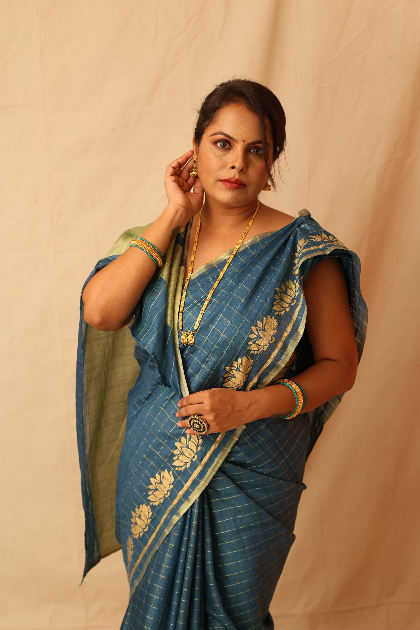 Traditional and Festive Green Semi-Silk Saree with Zari Checks Design